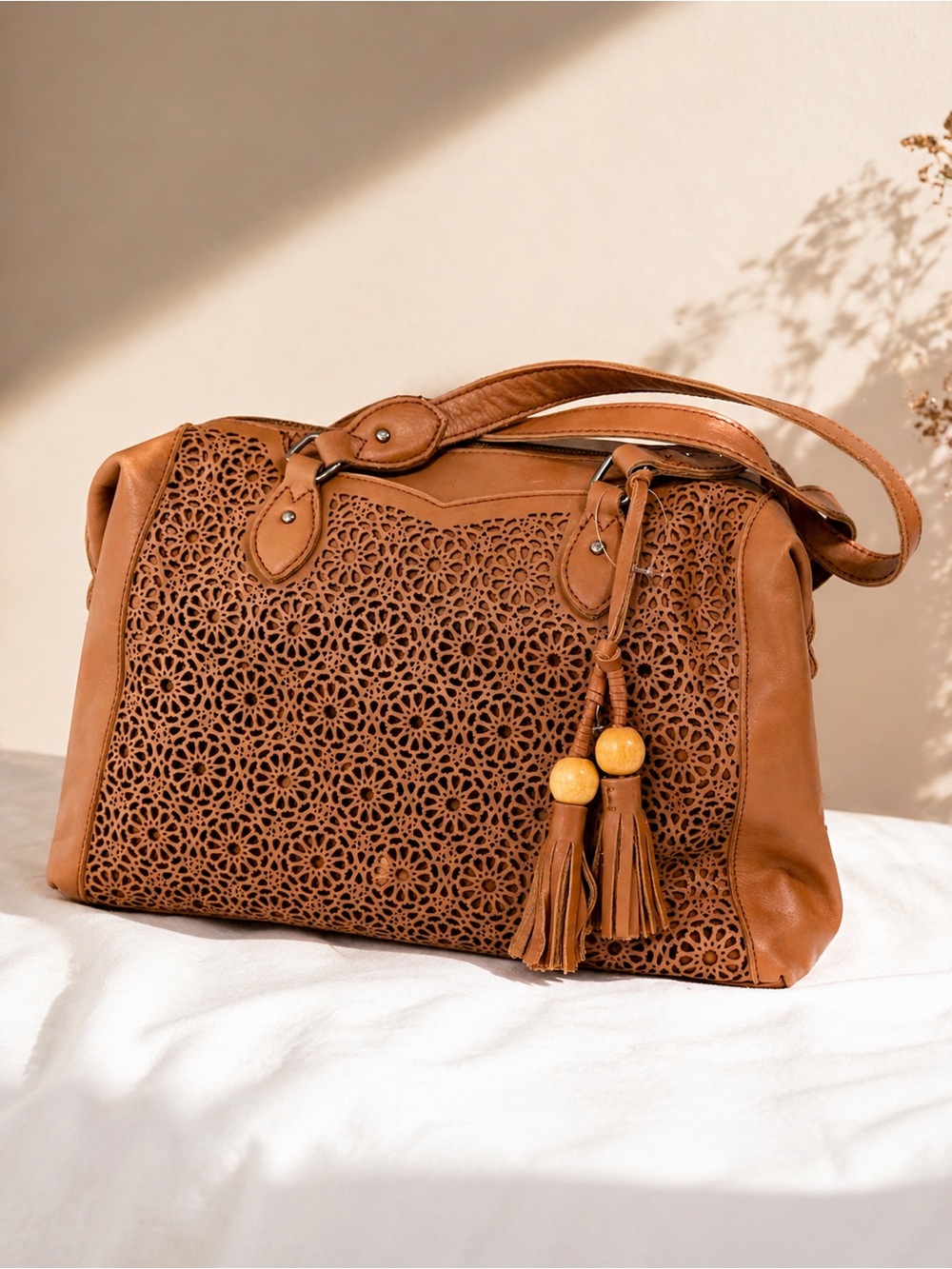 The Sak Tan Laser-Cut Shoulder Bag with Tassel Beads